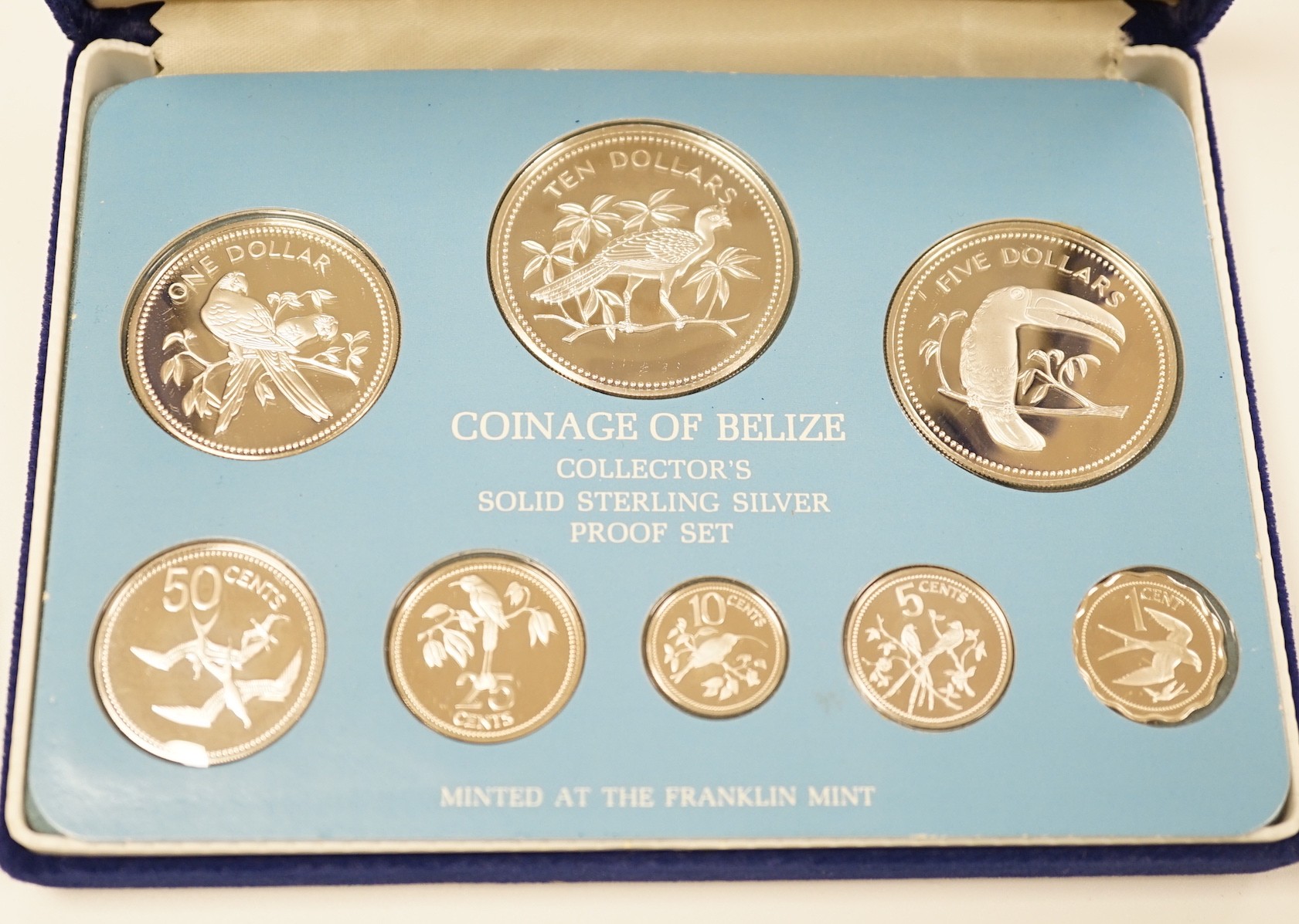 A group of UK and Belize commemorative silver coins to include coinage of Belize Franklin mint proof set 1976, Jamaica 1978 25th anniversary of the coronation silver $25, to Royal Mint 1972 crowns, two Pobjoy mint commem